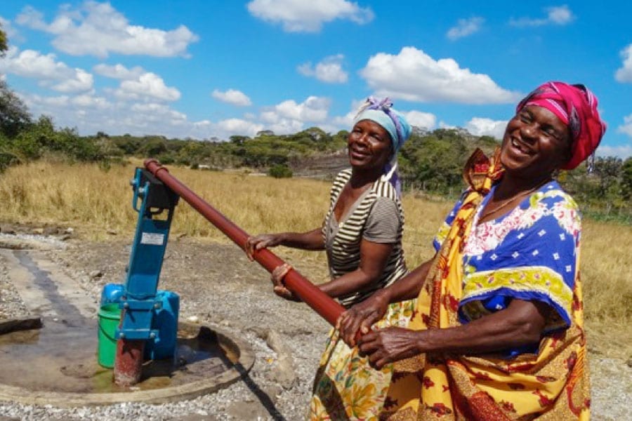 Two women at a Borehole Pump